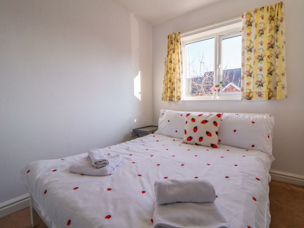 A bedroom with a bed and window at 10 Church Walks Chester