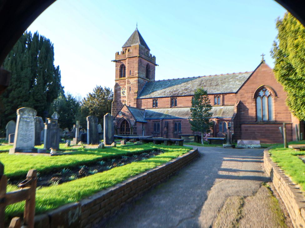 A church with gravestones and pathway at 10 Church Walks Chester