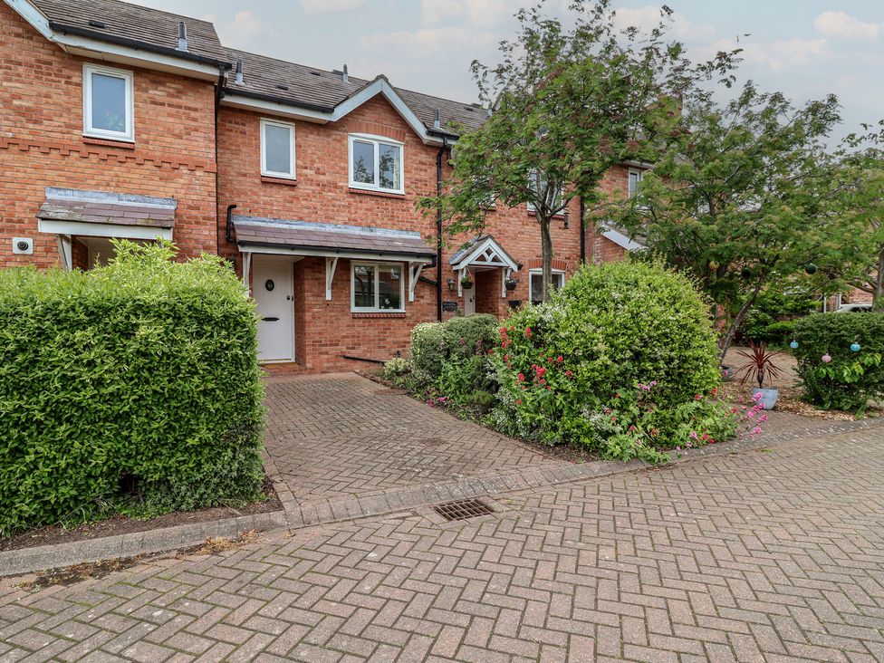 A house with bushes and trees in front at 10 Church Walks in Christleton