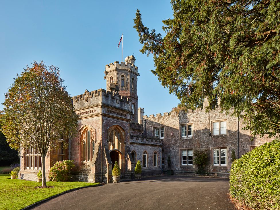 A castle with a tower and entrance at Uphill Manor in Uphill near Weston-Super-Mare