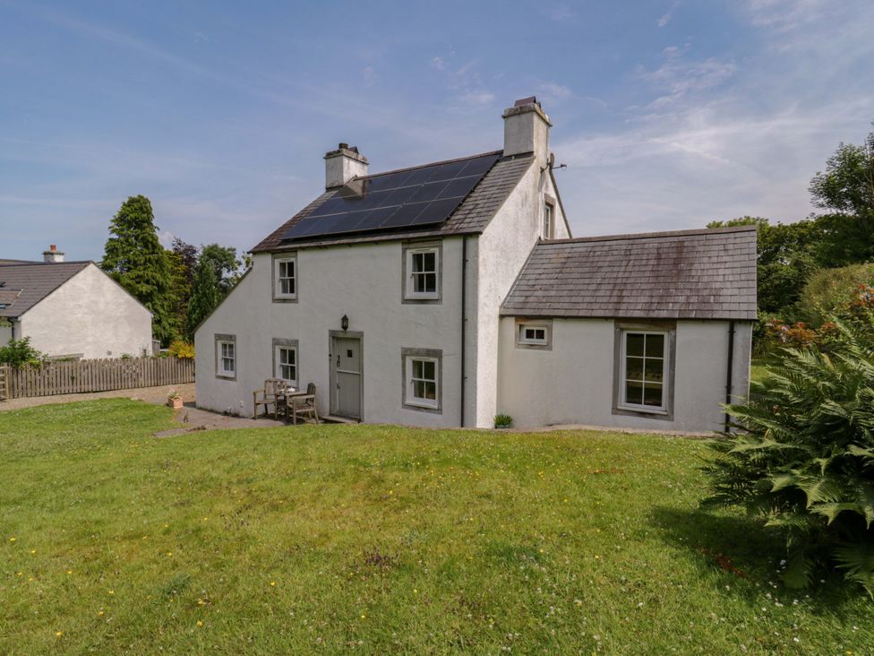 A house with solar panels in a garden at Cynefin, Newport, Pembrokeshire