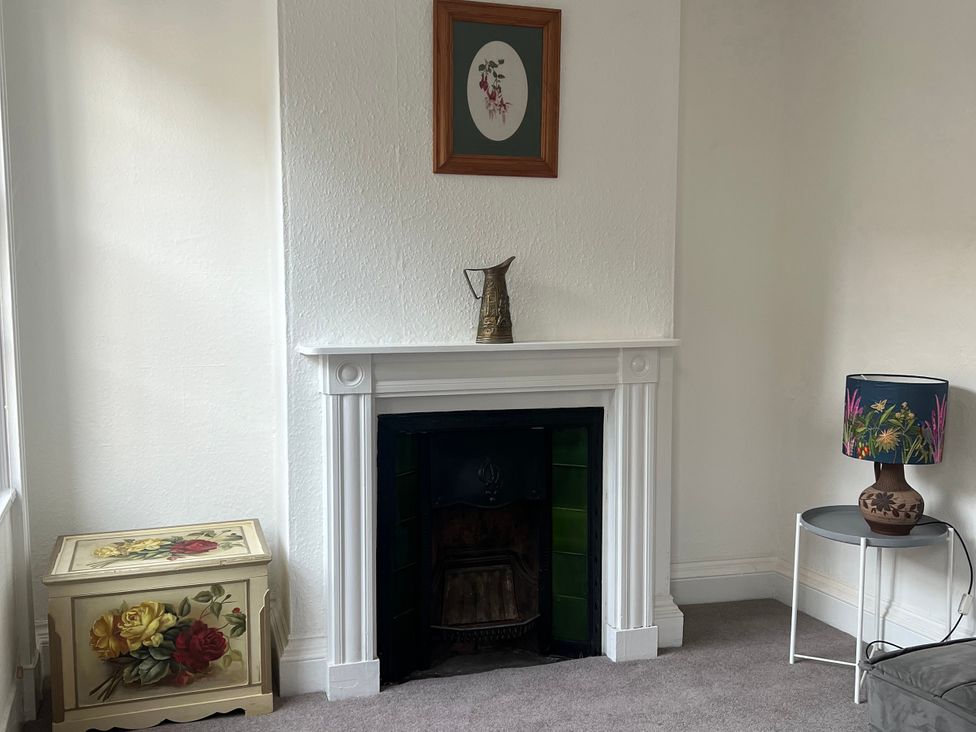 A living room with a fireplace and decorative items at Little Marrakesh Lodge in Worcester