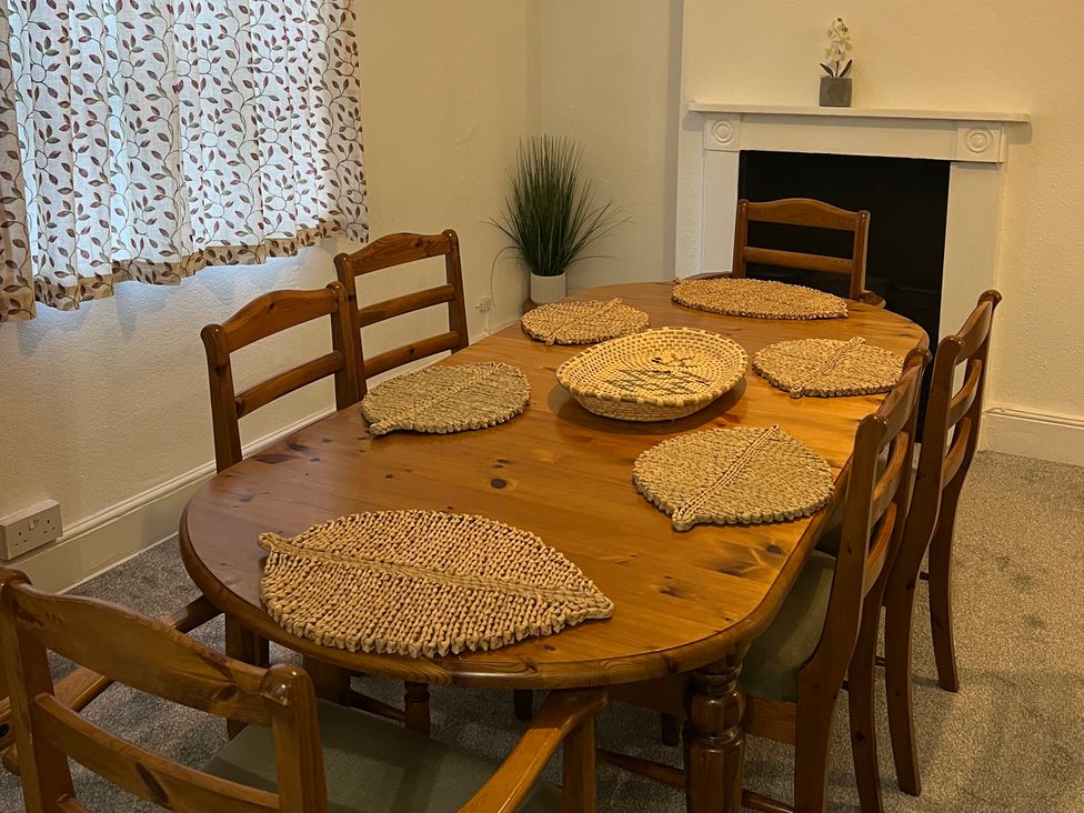 A dining room with a table set for meals at Little Marrakesh Lodge in Worcester