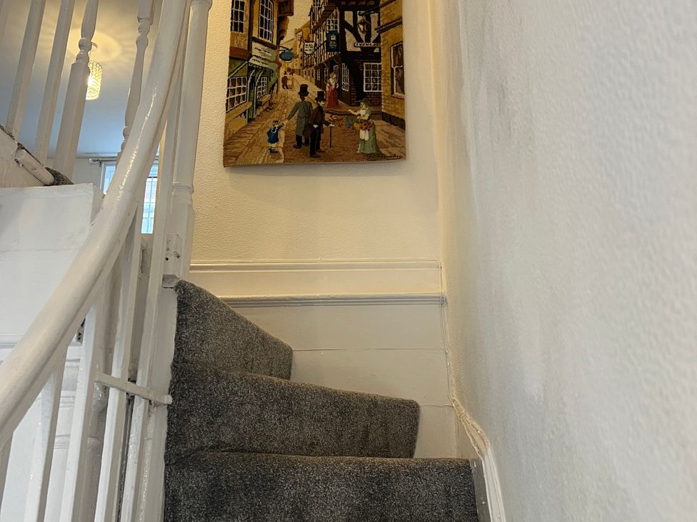 A staircase with a painting on the wall at Little Marrakesh Lodge in Worcester