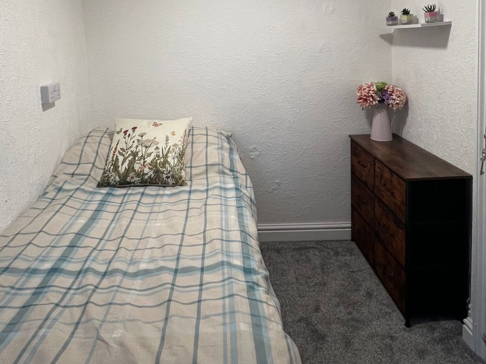 A bedroom with a bed and a drawer unit at Little Marrakesh Lodge in Worcester