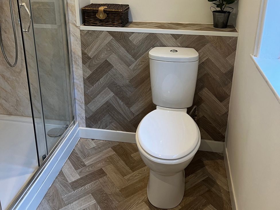 A bathroom with a toilet and shower at Little Marrakesh Lodge in Worcester