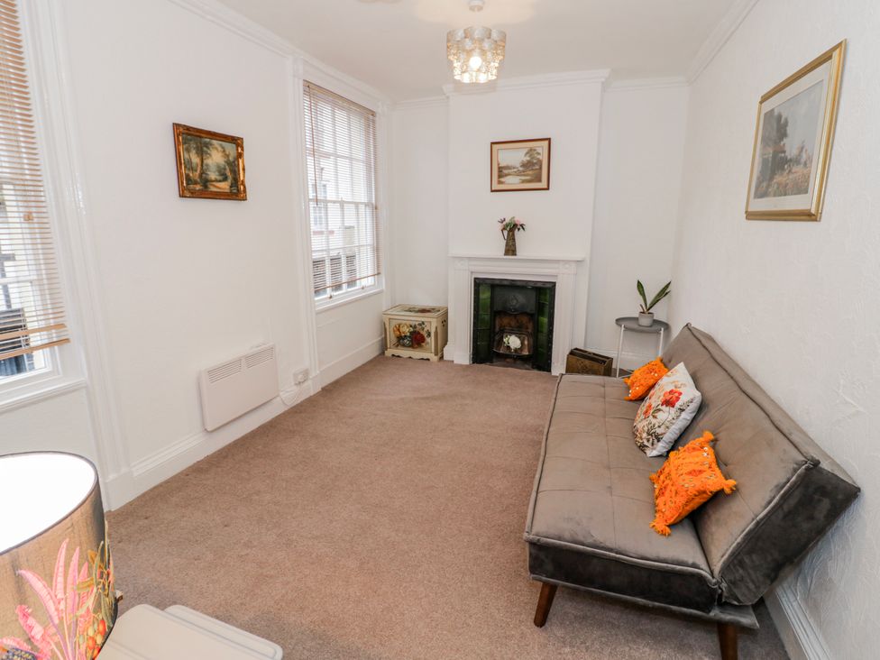 A living room with a sofa and fireplace at Little Marrakesh Lodge in Worcester