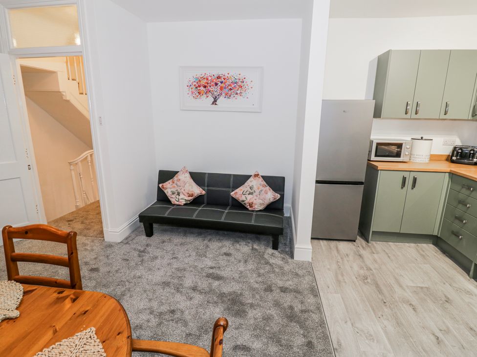 A kitchen with a sofa and dining table at Little Marrakesh Lodge in Worcester