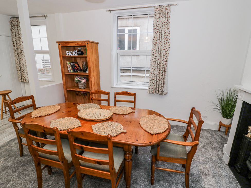 A dining room with a wooden table and chairs at Little Marrakesh Lodge in Worcester
