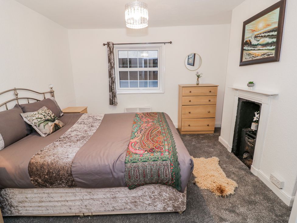 A bedroom with a bed and a dresser at Little Marrakesh Lodge in Worcester