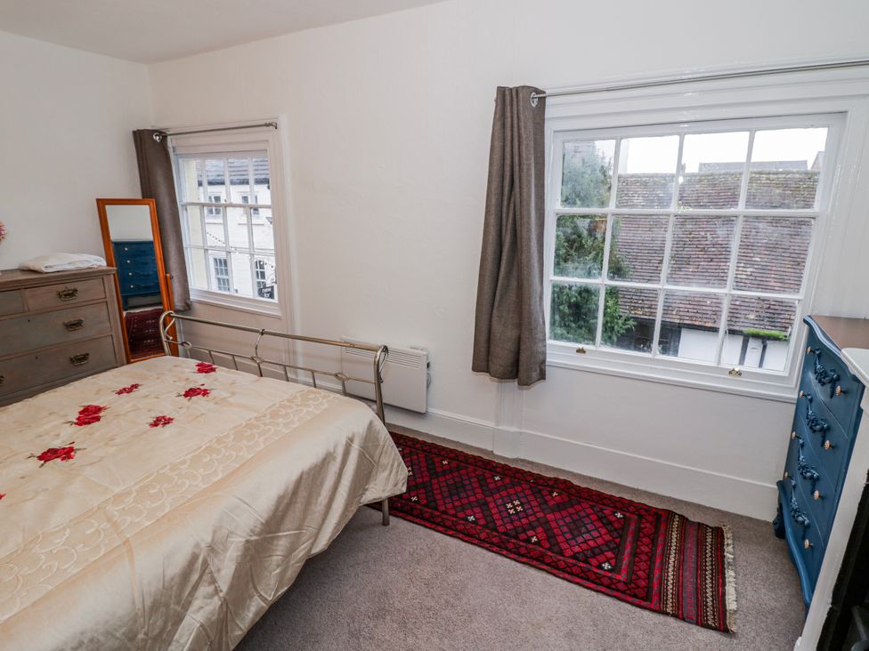 A bedroom with a bed and windows at Little Marrakesh Lodge in Worcester