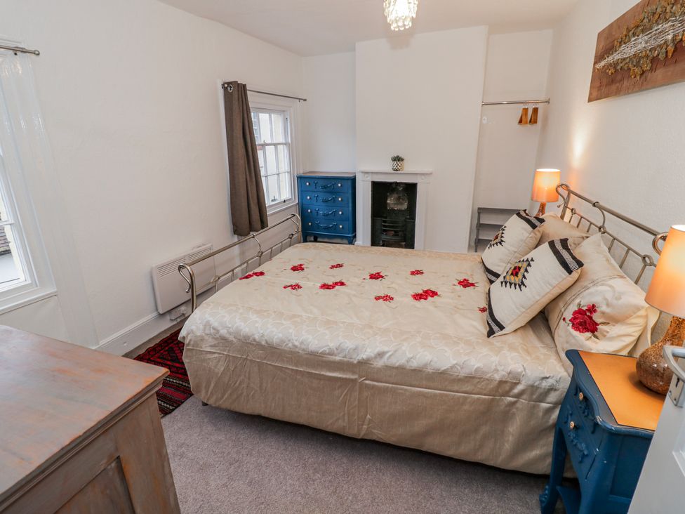 A bedroom with a bed and blue furniture at Little Marrakesh Lodge in Worcester