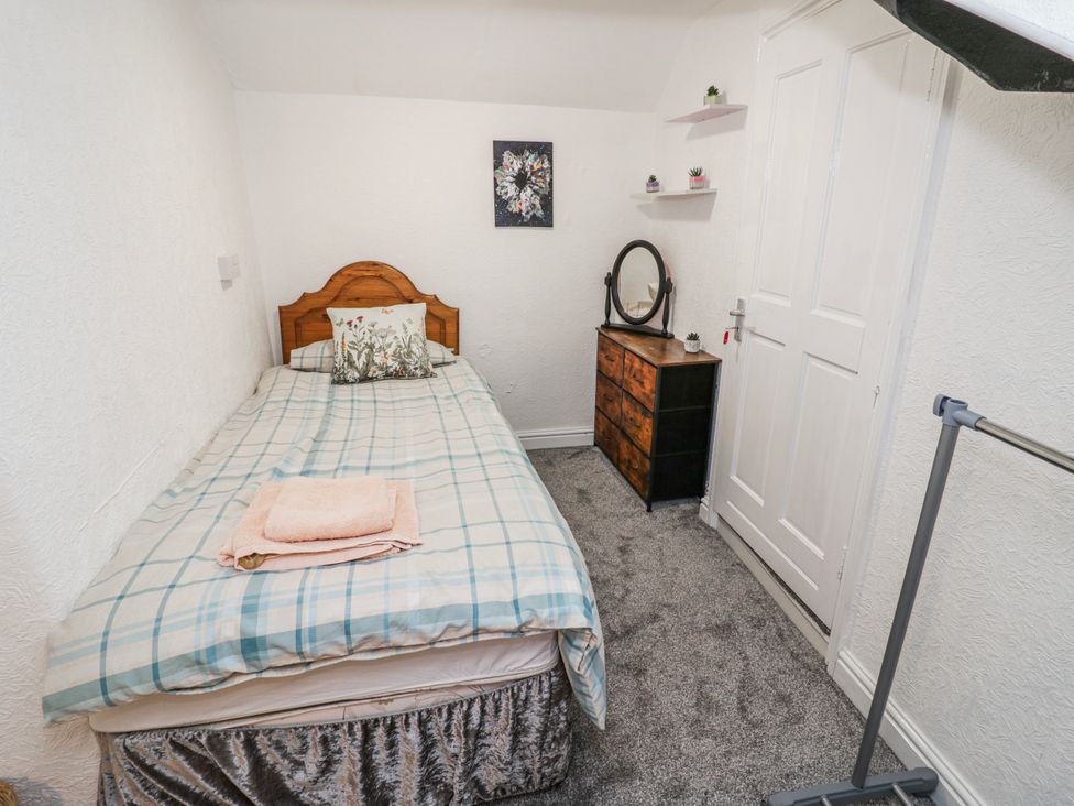 A bedroom with a bed and a dresser at Little Marrakesh Lodge in Worcester