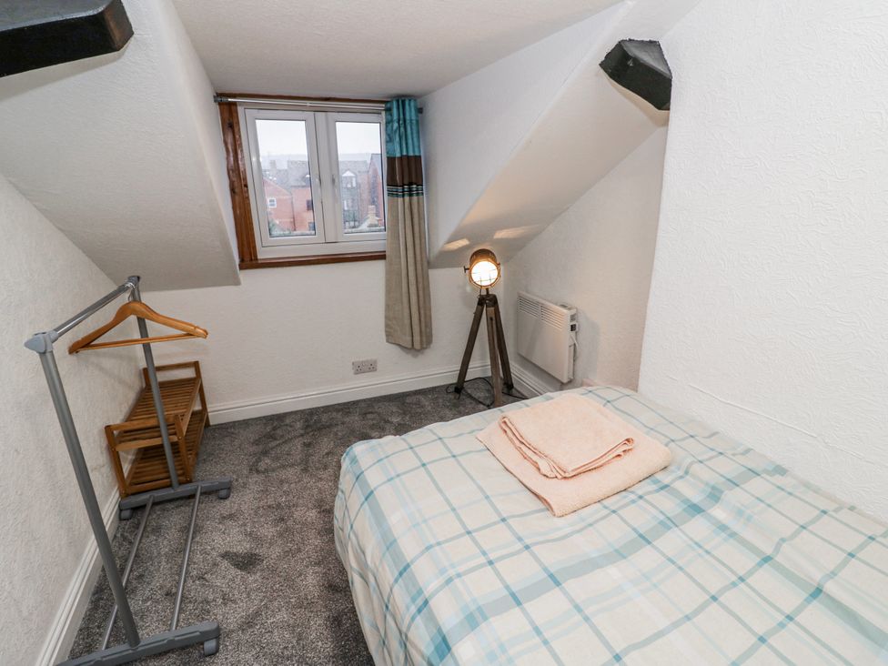 A bedroom with a bed and a lamp at Little Marrakesh Lodge in Worcester