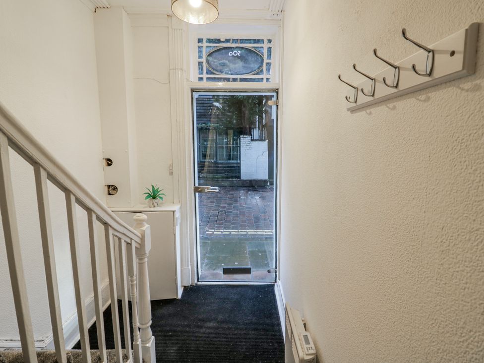 A hallway with a front door and staircase at Little Marrakesh Lodge in Worcester