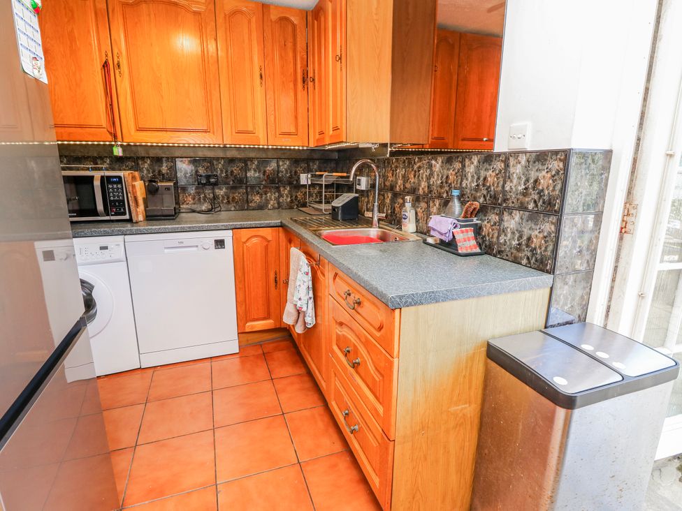 A kitchen with appliances and cabinets at 2 Trelawny Way Bembridge
