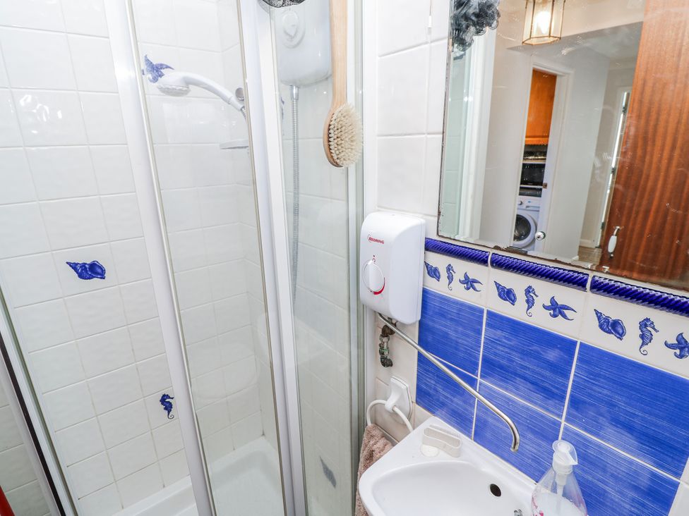 A shower and sink in a bathroom at 2 Trelawny Way in Bembridge