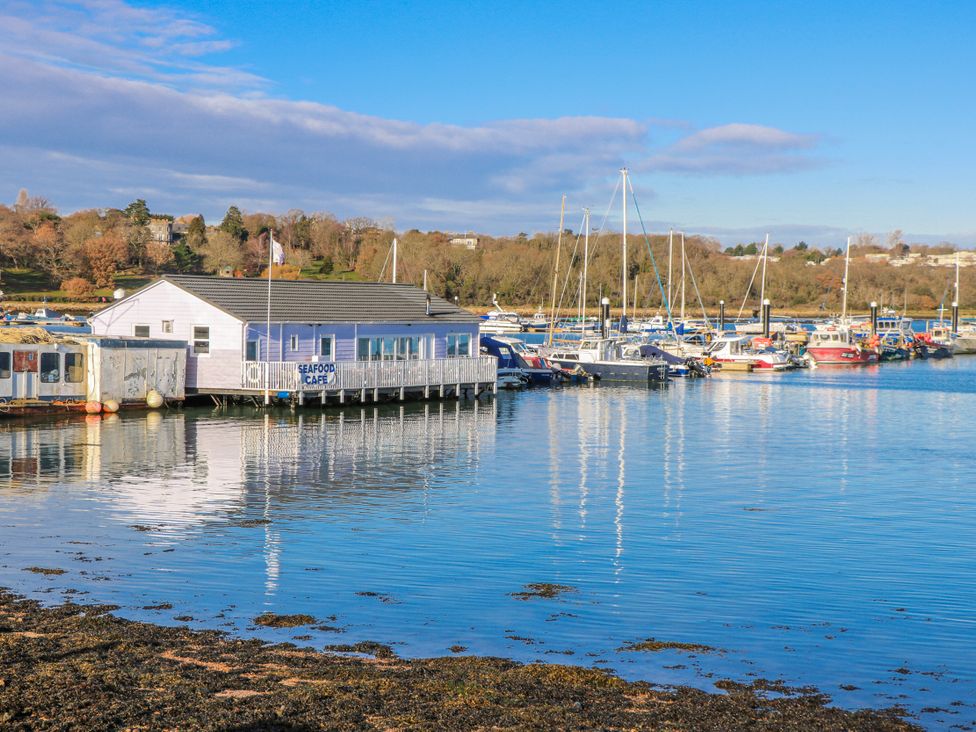 A seafood cafe by the water with boats docked at 2 Trelawny Way Bembridge