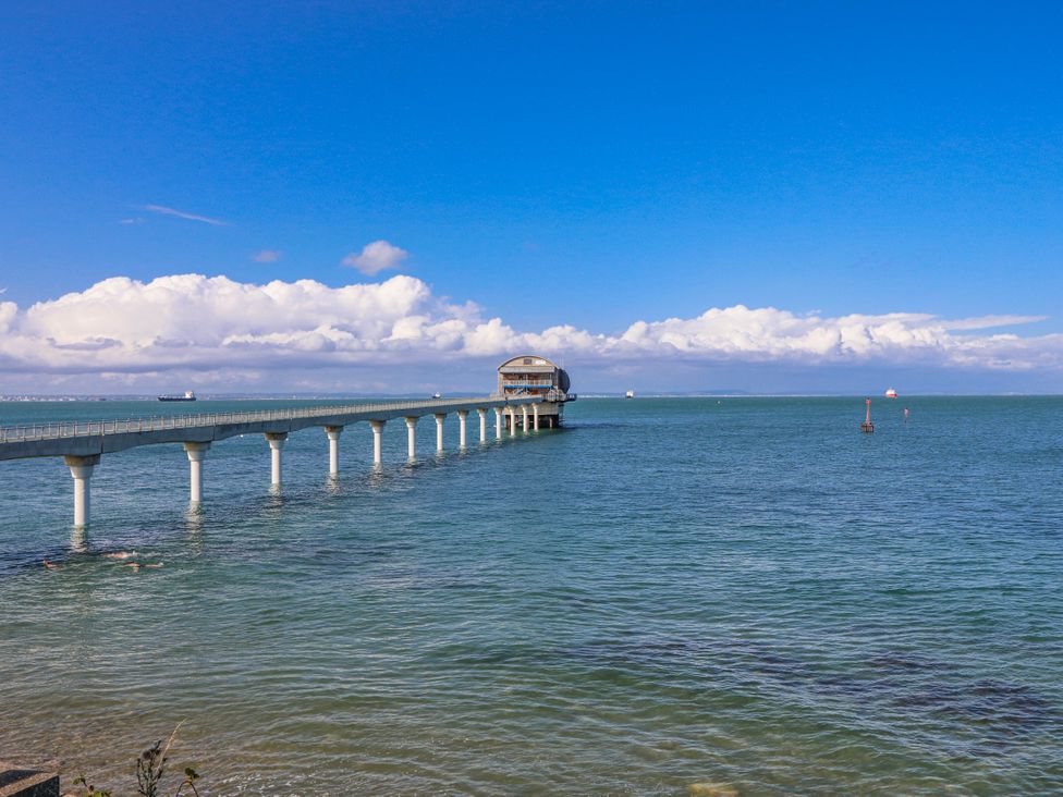 A pier extending over water at 2 Trelawny Way in Bembridge