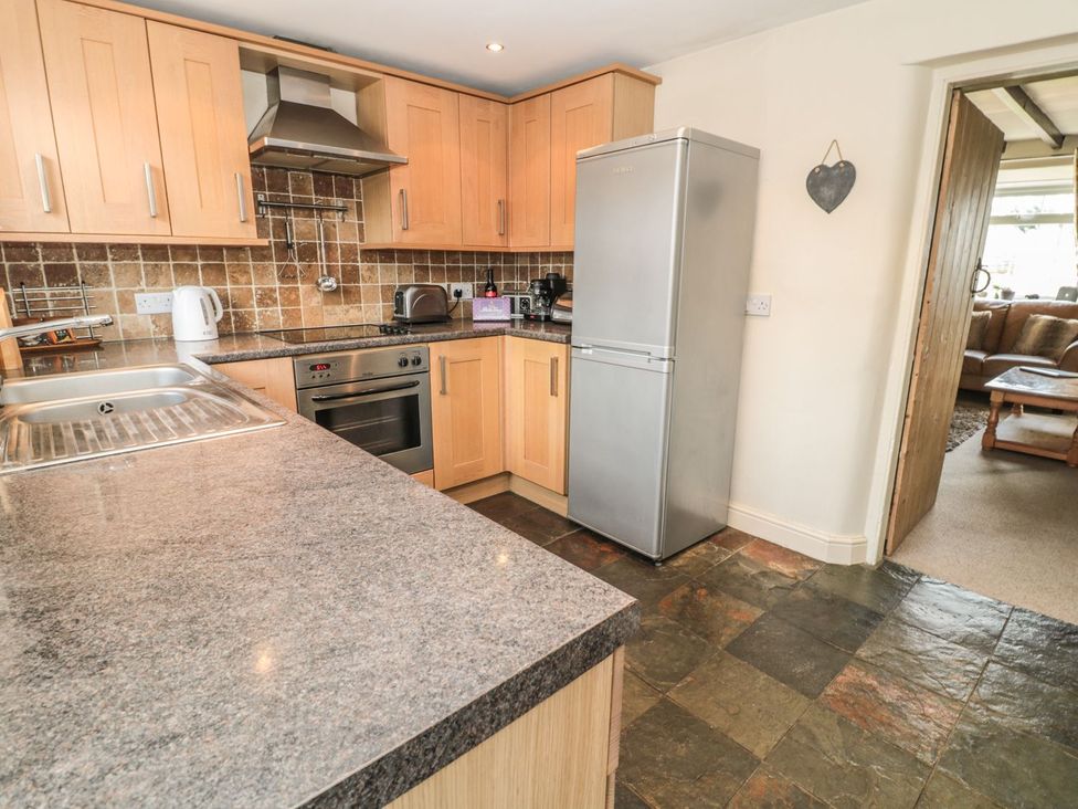 A kitchen with a refrigerator and oven at Shepherds Nook in Chathill