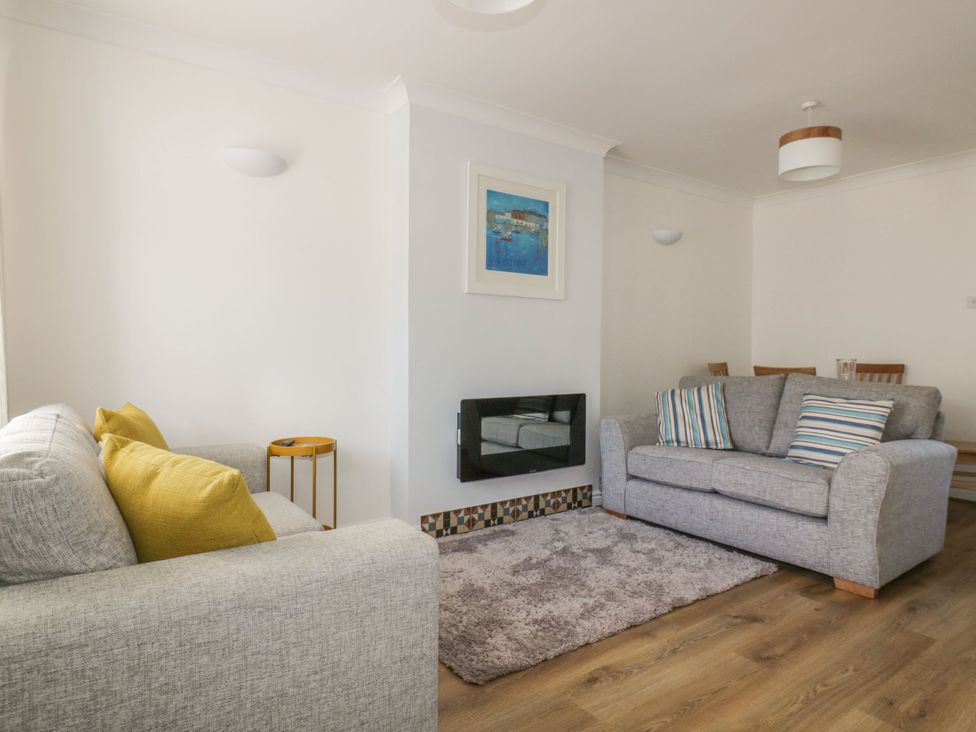A living room with sofas and a coffee table at Seahorses in Padstow