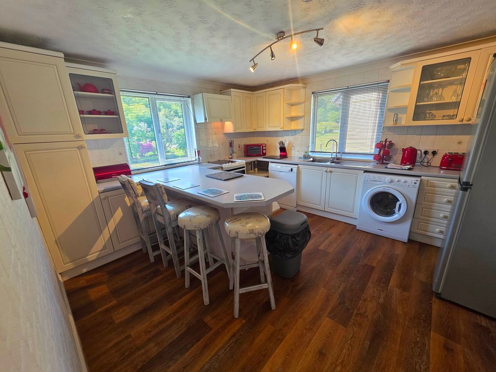 A kitchen with appliances and a countertop at Lakeview Villa near Liskeard