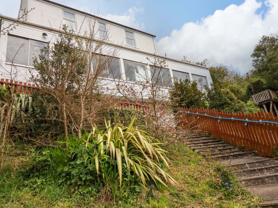 A house with stairs and plants leading to it at Flat 5 in Looe