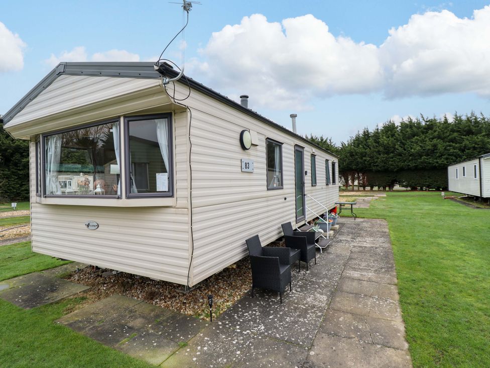 A caravan with outdoor seating at Southview Leisure Park - Firs 83 Skegness