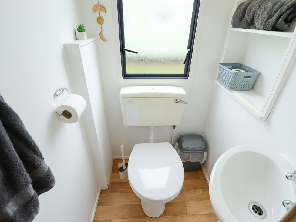 A bathroom with toilet and washbasin at Southview Leisure Park - Firs 83 Skegness