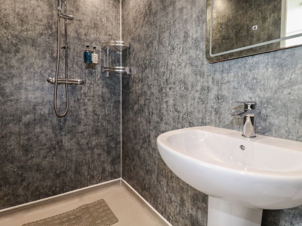 A bathroom with a shower and sink at Sea View in Newquay