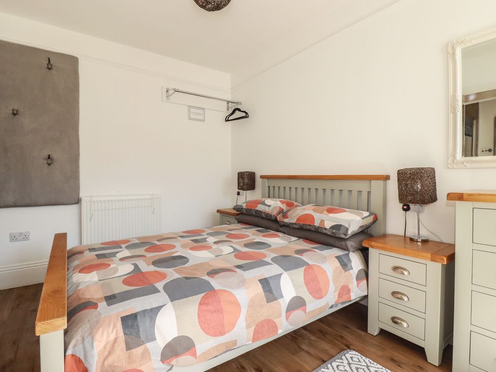 A bedroom with a bed and bedside table at Sea View in Newquay