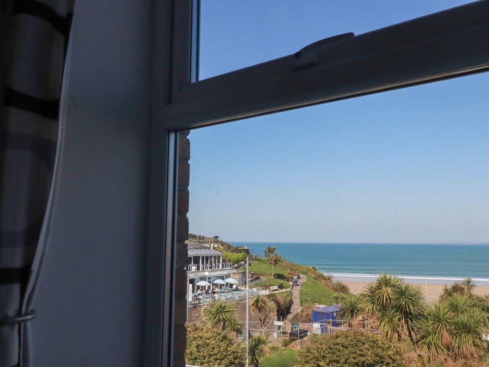 View from a window showing a beach and sea at Sea View in Newquay