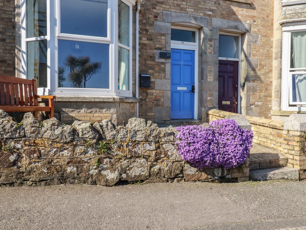 An outdoor view with two doors and flowers at Sea View in Newquay