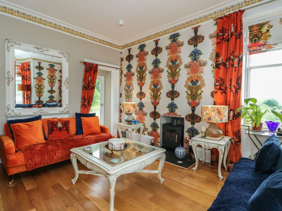 A living room with a sofa and coffee table at Heather Island View