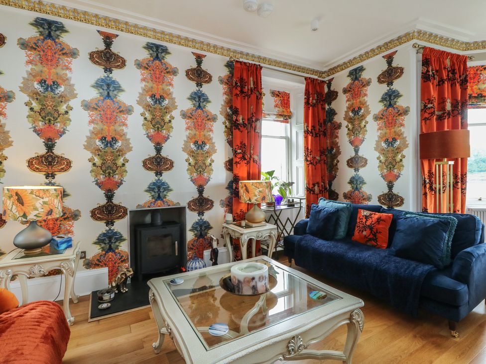A living room with a sofa and coffee table at Heather Island View 