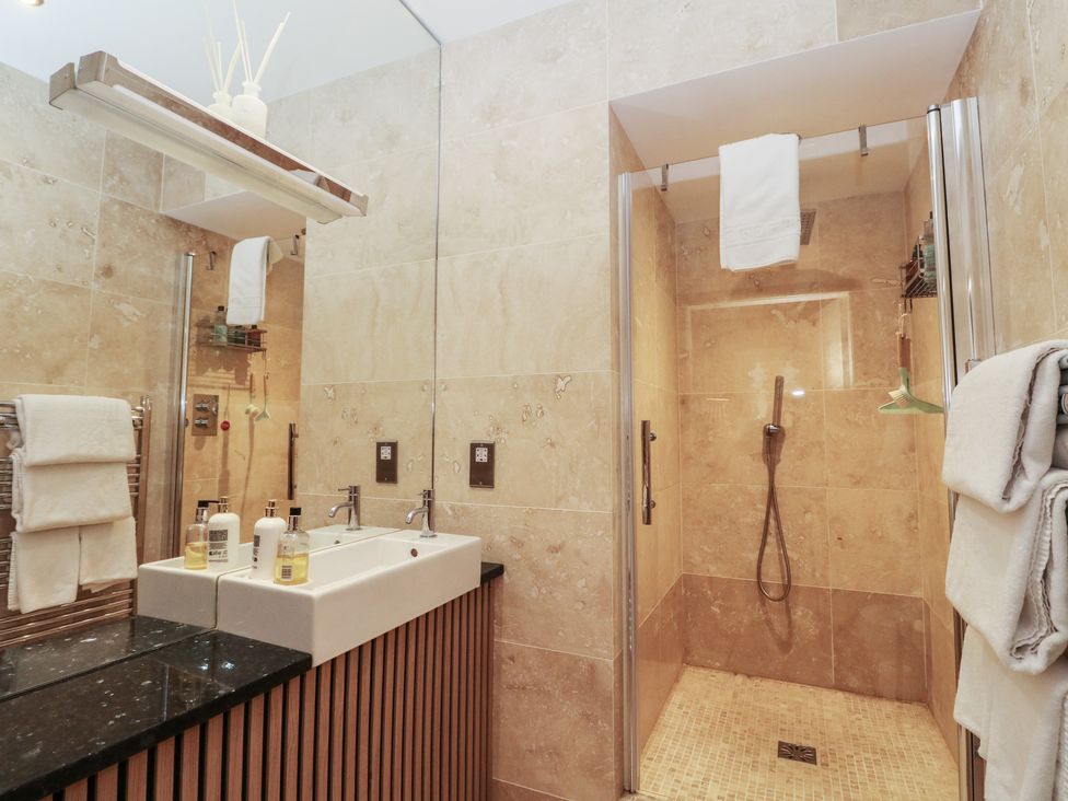 A bathroom with a sink and shower at Heather Island View