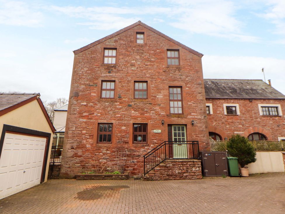 A building with windows and a door at High Mill House in Penrith