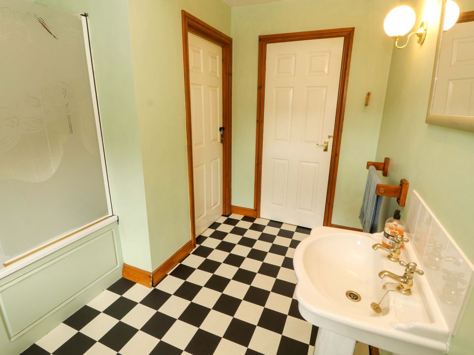 A bathroom with a sink and shower at High Mill House in Penrith
