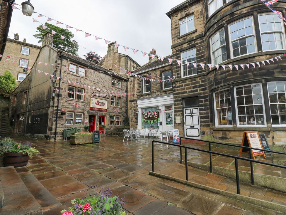 An outdoor area with a cafe and deli at Riverview Cottage in Holmfirth
