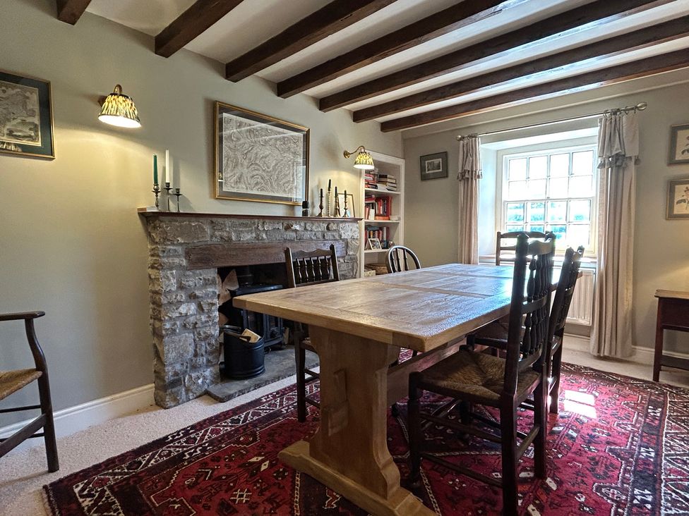 A dining room with a table and chairs at Tarn House in Hawes