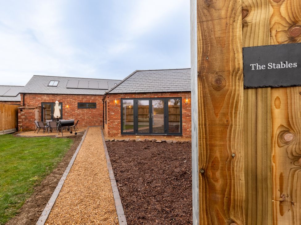 An outdoor area showcasing seating and a pathway at The Stables Catworth