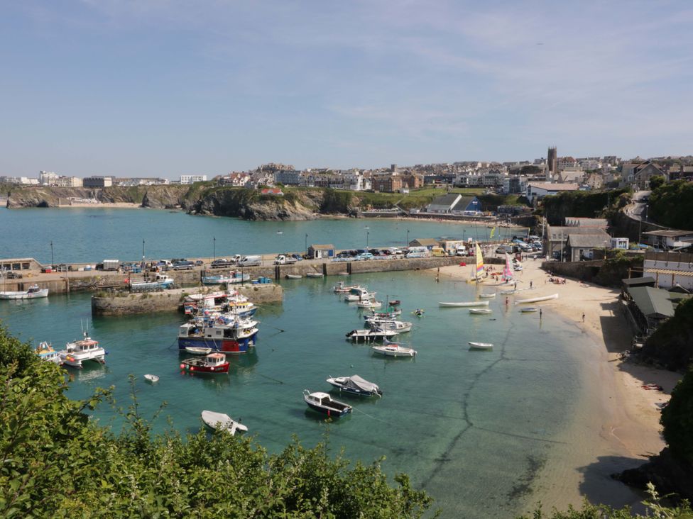 A view of a harbor with boats and buildings at La Casita in Newquay