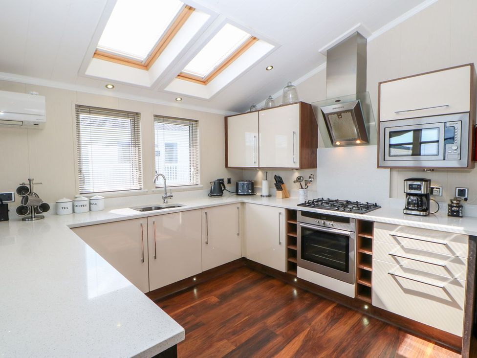 A kitchen with oven, sink, and countertop at 37 Horizon Park in Hartlepool