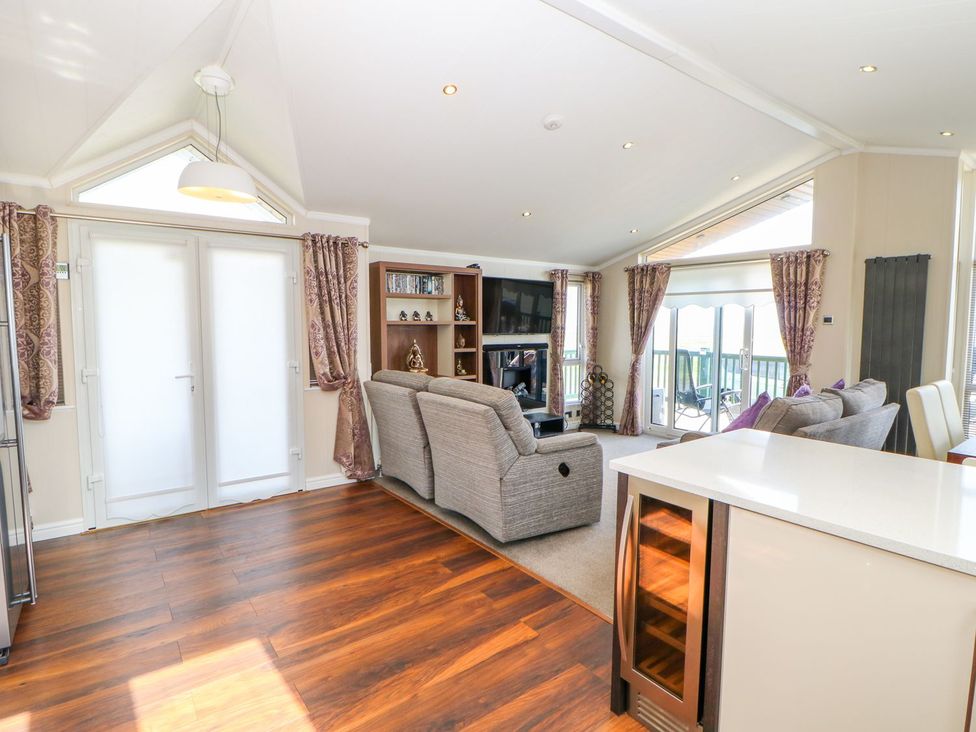 A living room with a sofa and television at 37 Horizon Park in Hartlepool
