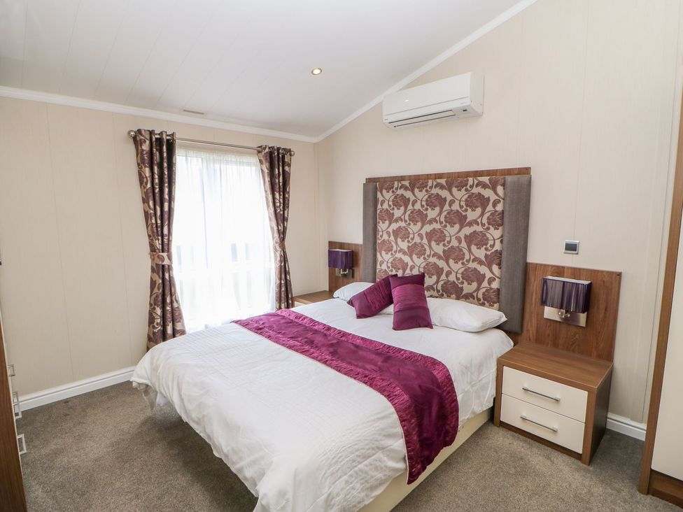 A bedroom with a bed and window at 37 Horizon Park in Hartlepool