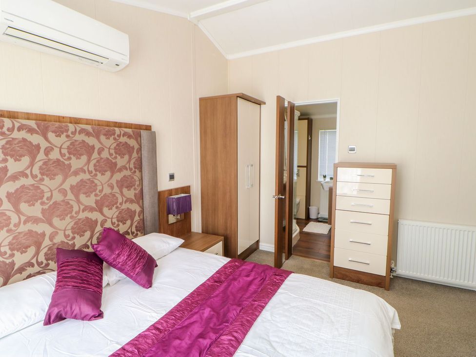 A bedroom with a bed and furniture at 37 Horizon Park in Hartlepool