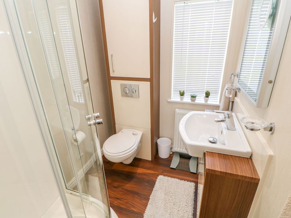 A bathroom with shower, toilet, and sink at 37 Horizon Park in Hartlepool
