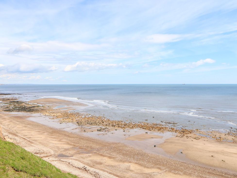 A coastal view of the sea and beach at 37 Horizon Park in Hartlepool