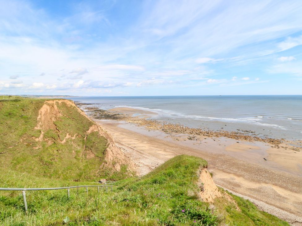 A beach with cliffs and sea at 37 Horizon Park in Hartlepool