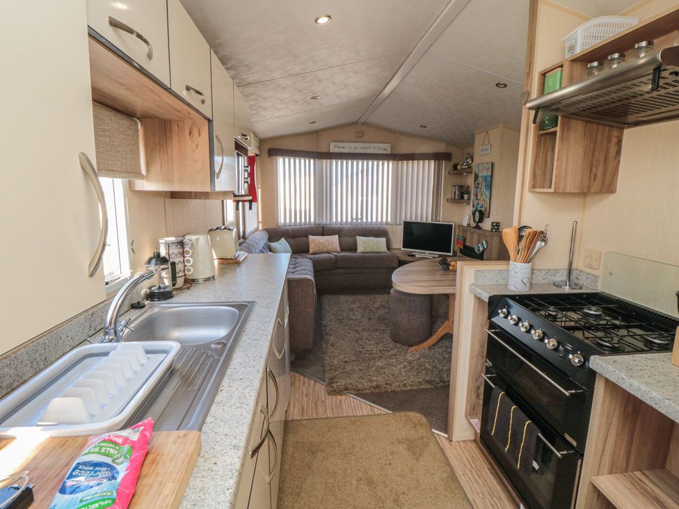 A kitchen with seating area at Caravan 132 in Redcar